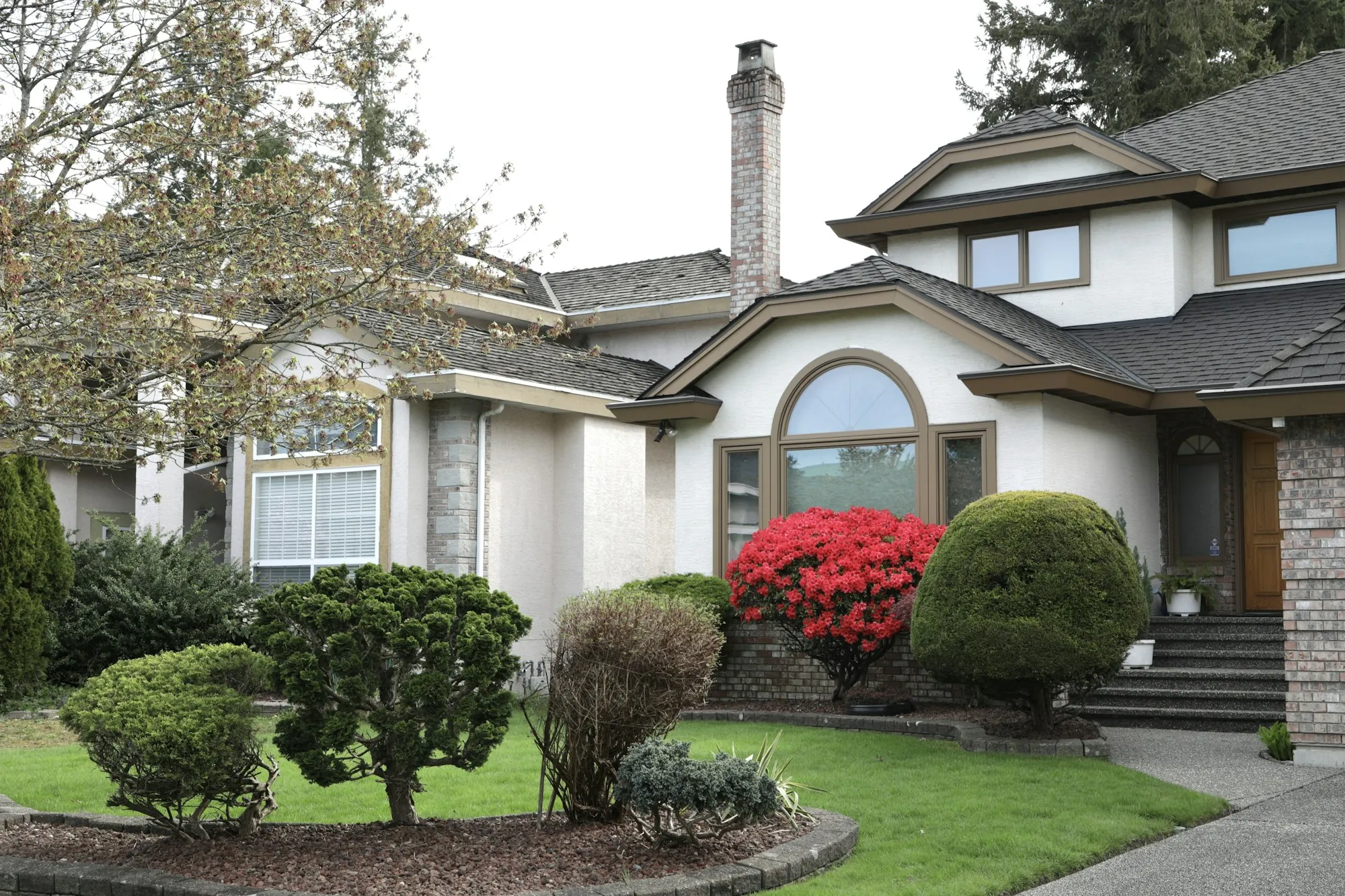Suburban house with landscaped shrubs